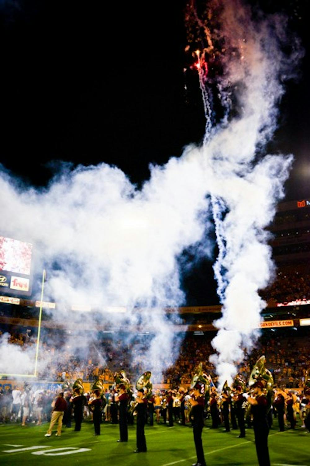 Fireworks explode above the crowd at Sun Devil Stadium before the game against Weber St on Aug. 28. Firework restrictions will remain in place during the game against UCLA on Sept. 24. (Photo by Andrew Ybanez)