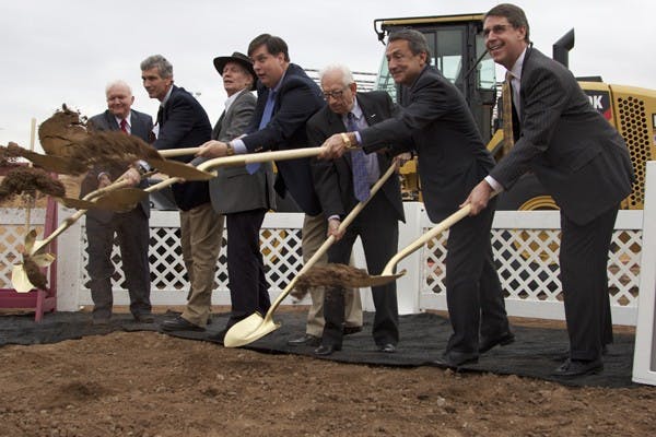 Developers for Block 12 throw dirt with golden shovels as part of a breaking ground ceremony for the new building on Jan. 24 in Tempe. The building will be five stories tall and cost 54.5 million dollards. (Photo by Ana Ramirez)