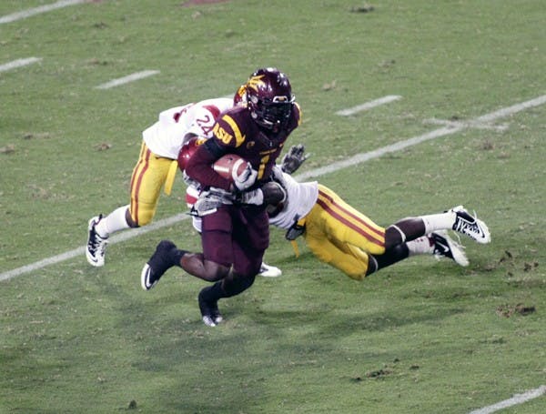 ALL FOR ONE: ASU senior wide receiver Mike Willie breaks a tackle while running up field after a catch during the Sun Devils’ victory over USC on Saturday. Junior quarterback Brock Osweiler has made good use of all his receivers so far this season. (Photo by Beth Easterbrook)