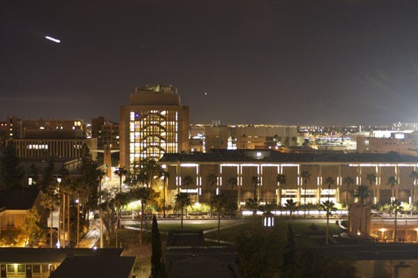 NIGHT SKY: A plane streaks across the sky over the Tempe Campus Monday night. (Photo by Scott Stuk)