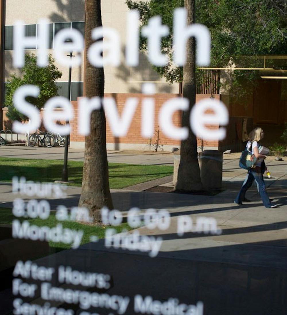 FEMALE STUDENT BODY: Female students pass by the Health Services Building on the Tempe campus, which offers a variety of health care options for Sun Devils. USG is working to ensure that the health center addresses issues more specific to women.  (Photo by Michael Arellano)