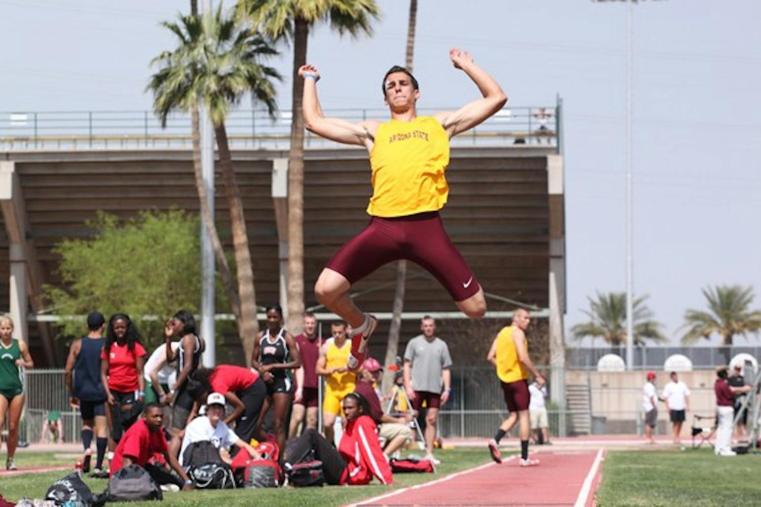 Back Under the Sun: ASU junior Jamie Sandys attempts the long jump at the Baldy Castillo Invitational on Saturday in Tempe. Both the men’s and women’s track teams split between the ASU Invitational in Tempe and the Stanford Invitational in Palo Alto, Calif., this weekend. (Photo by Beth Easterbrook)