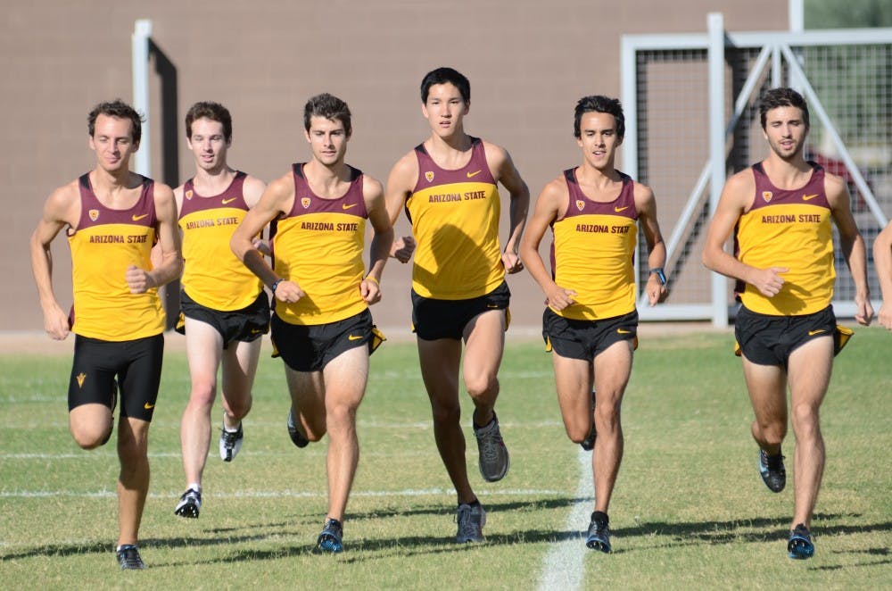 Members of the cross country team participate in strides at a meet last season.
