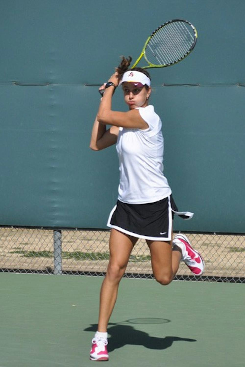 Road Challenges: ASU freshman Jacqueline Cako follows through on a forehand against Pacific on Feb. 13. The Sun Devils dropped two away matches against two top-10 teams over the weekend, including a close 4-3 loss to Cal on Saturday. (Photo by Sierra Smith)