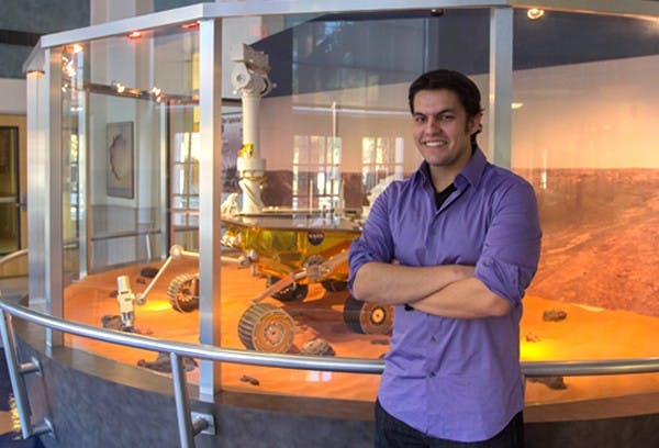 Graduate student Michael Veto is working to build a camera that has capabilities of being attached to spacecraft for research in the near future. (Photo by Dominic Valente)