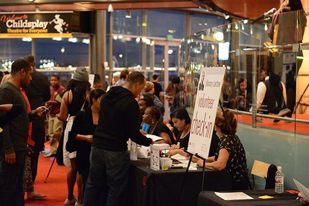 Dozens of fans of Aaron McGruder and the "Boondocks" receive their tickets for the annual Visionary Lecture Series at the Tempe Center for the Arts on Thursday, Nov. 6, 2014. The lecture featured talks on race and democracy. (Photo by Jonathan Williams)