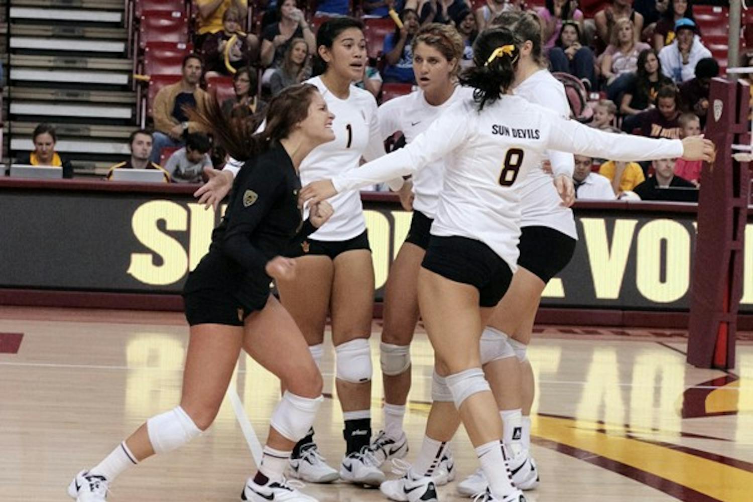 RALLYING TOGETHER: Several ASU volleyball players celebrate after a point during the third game of the Sun Devils’ Nov. 7 match against UCLA. After a close loss to No. 2 Cal on Oct. 1, the Sun Devils believe they can upset the Bears and No. 5 Stanford over the weekend. (Photo by Michaela Mader)