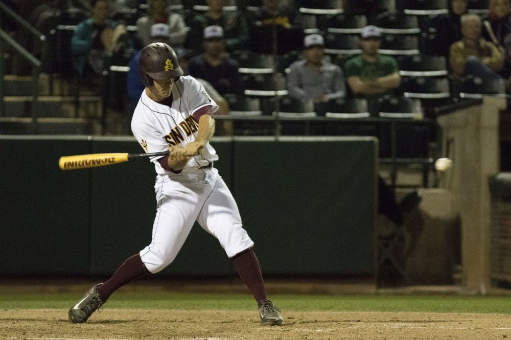 Sophomore David Greer hits for a single in the bottom of the fourth inning against University of New Mexico at Phoenix Municipal Stadium on Wednesday March 18, 2015. The Sun Devils defeated the Lobos 4-3. (Jacob Stanek/ The State Press)