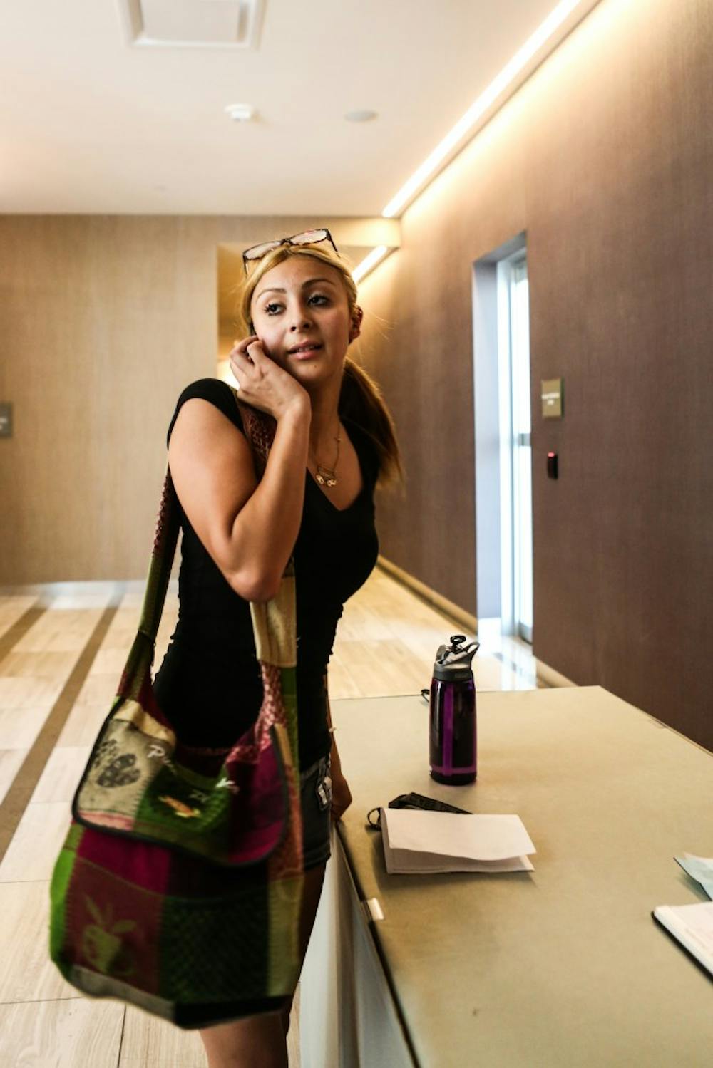 Health policy freshman Jasmine Diaz checks in with ASU officials at the Westin hotel. Taylor Place was over booked and the Westin Hotel is renting rooms to students. (Photo by Dominic Valente)
