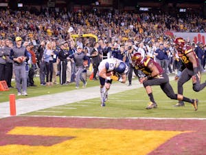 Freshman David Sills, in at&nbsp;wide receiver, makes the catch and crosses the goal line amid defensive pressure to score WVU's final touchdown during the 2016 Motel 6 Cactus Bowl. The Mountaineers wins over ASU 43 - 42 at Chase Field in Phoenix, AZ.