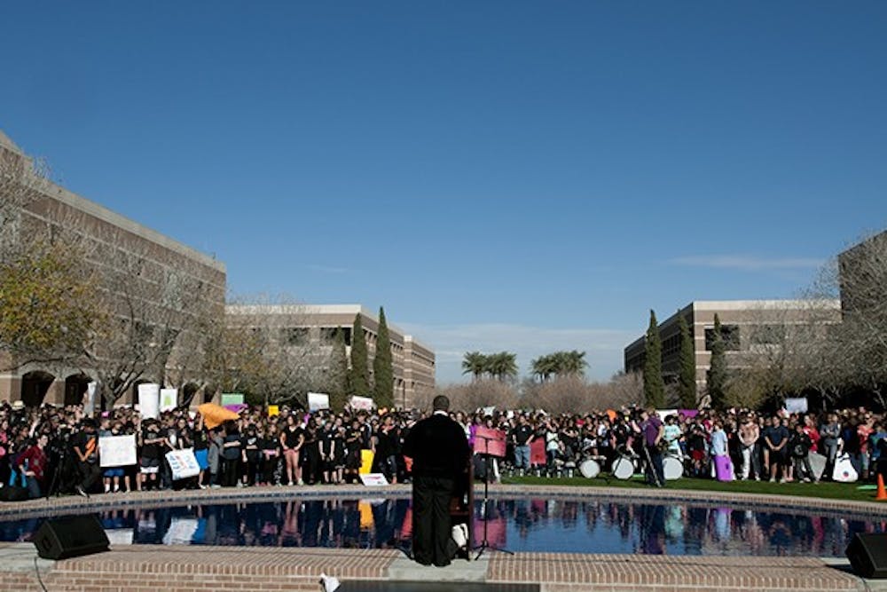Toting protest signs and smiles, hundreds of elementary students gather at ASU’s West Campus on Wednesday Jan. 22 to reenact MLK's "I Have a Dream Speech" that took place over half a century ago in the nations capital. (Photo by Mario Mendez)