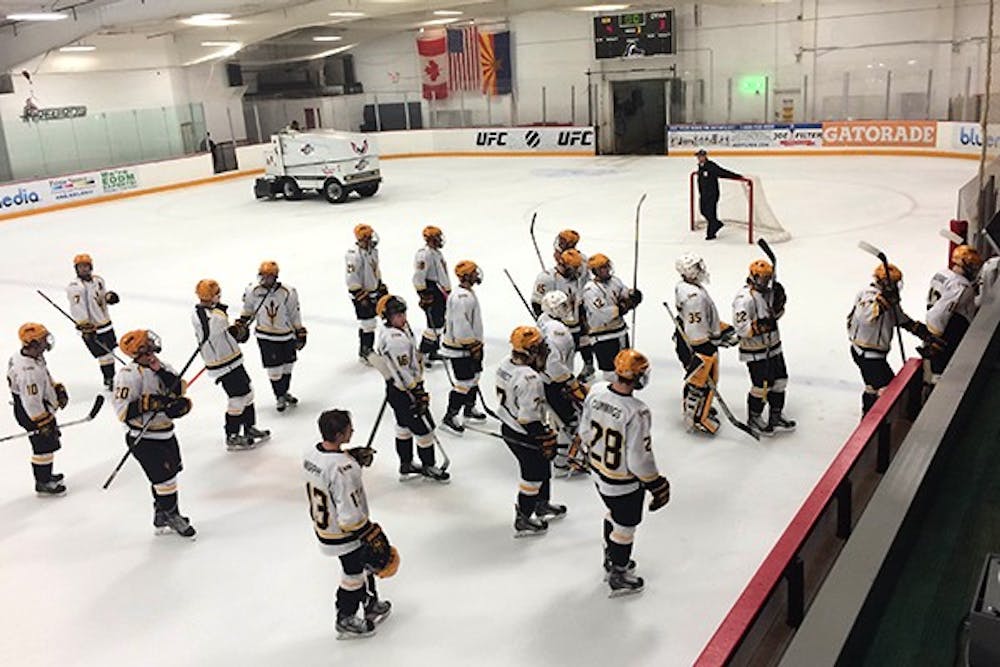 The Sun Devil hockey team heads back to the bench after warming up for its game against Niagara University on Sept. 20, 2014. The Sun Devils beat the Purple Eagles 4-3. (Photo by Fabian Ardaya)