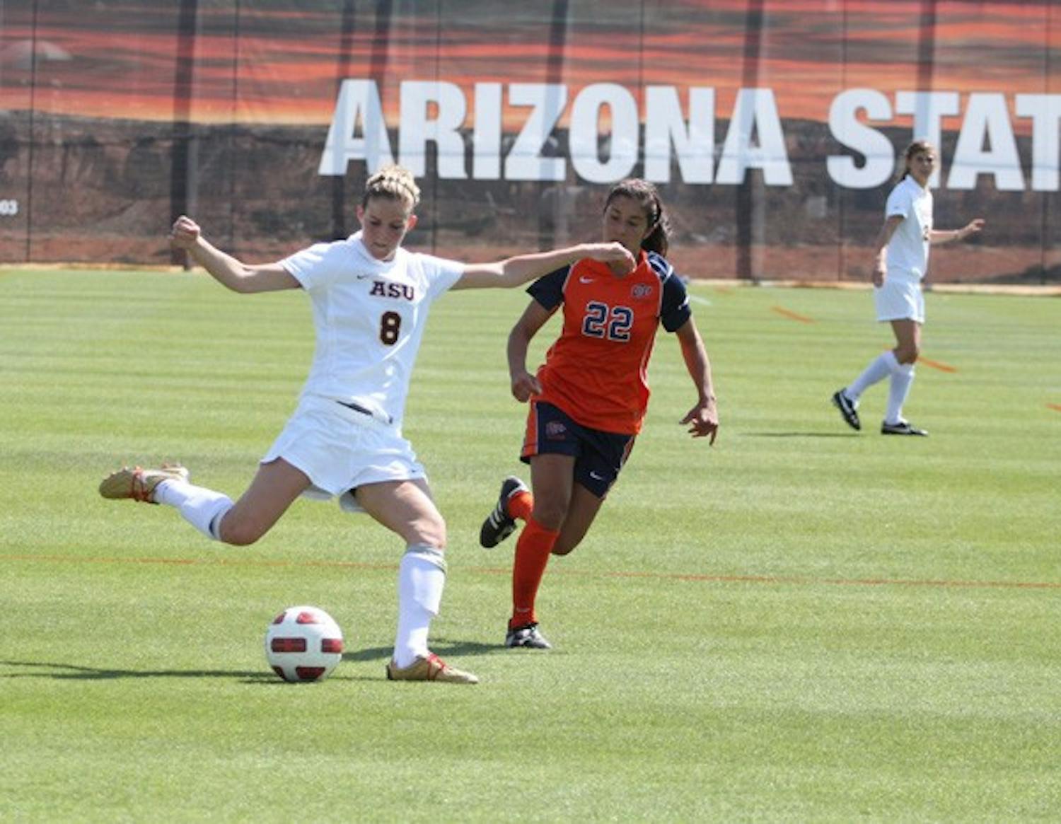 On display: ASU freshman forward Devin Marshall makes a cross during the Sun Devils’ spring exhibition game against UTEP on Saturday. ASU fell 1-0 in what was a closely contested match. (Photo by Elijah Grasser)