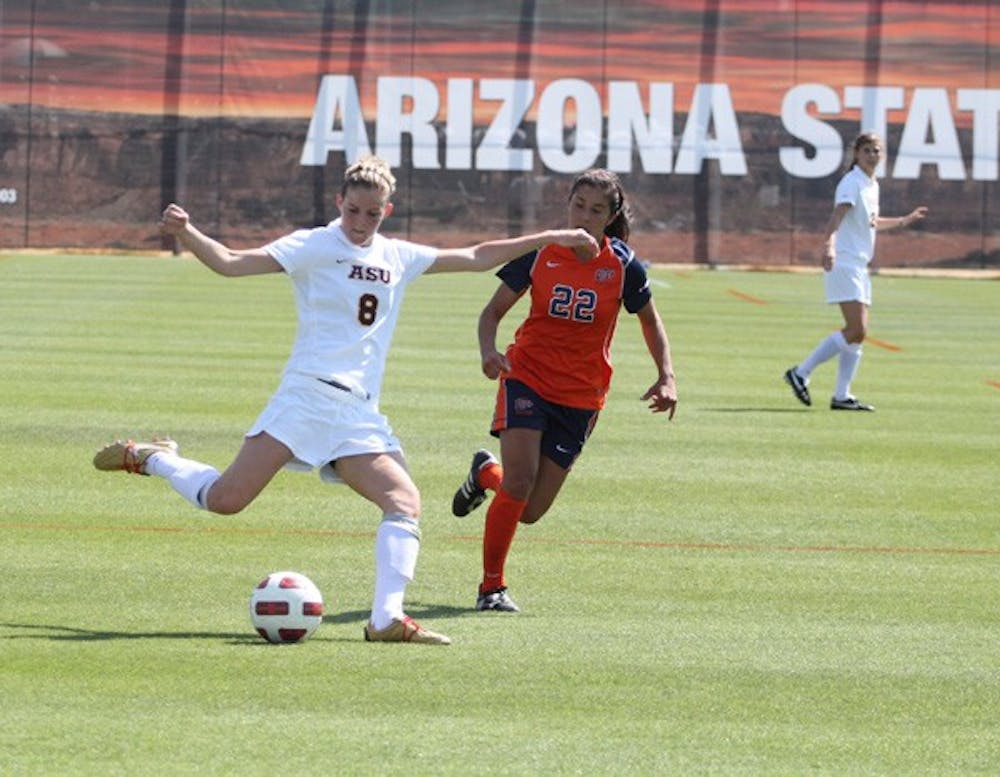 On display: ASU freshman forward Devin Marshall makes a cross during the Sun Devils’ spring exhibition game against UTEP on Saturday. ASU fell 1-0 in what was a closely contested match. (Photo by Elijah Grasser)