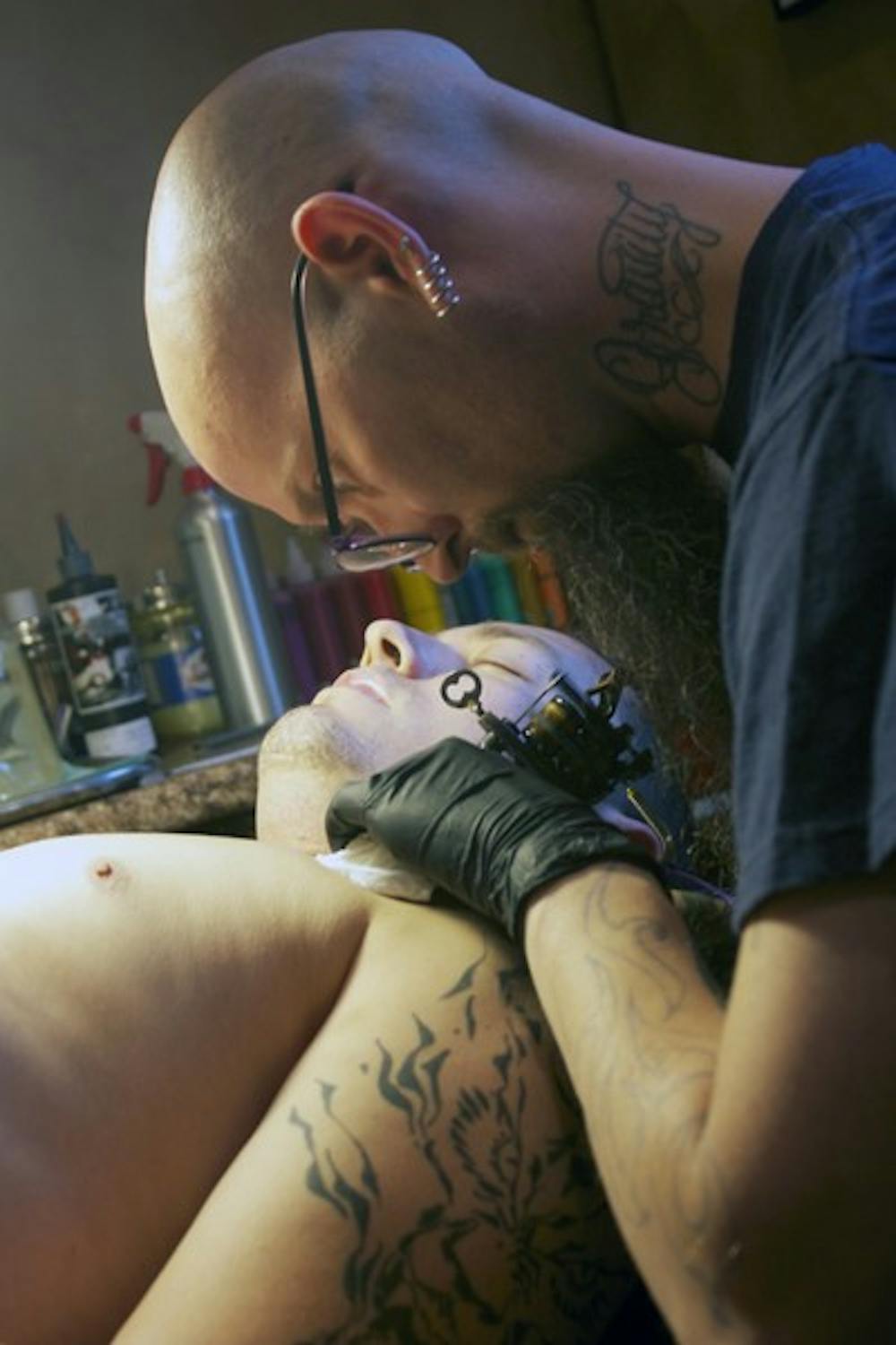 FREE SPEECH ART: Nathan Rios gets a tattoo done across his chest by Living Canvas Tattoo artist, Chris Parrish. The issue of whether tattoos are protected under the First Amendment right of freedom of speech has long been debated by Constitutional experts. (Photo by Shawn Raymundo)