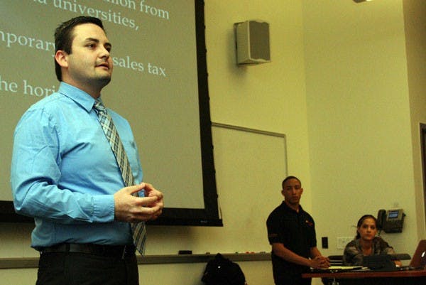 BUDGET BATTLE: David Martinez, the government affairs director of the Arizona Students' Association, spoke Wednesday night at the ASASUD meeting about his efforts at the State Capitol to lobby against budget cuts at Arizona schools.  (Photo by Lisa Bartoli)