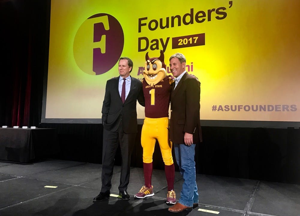 Award recipients&nbsp;Michael Burns and Jack Furst pose with Sparky on Founders' Day 2017.