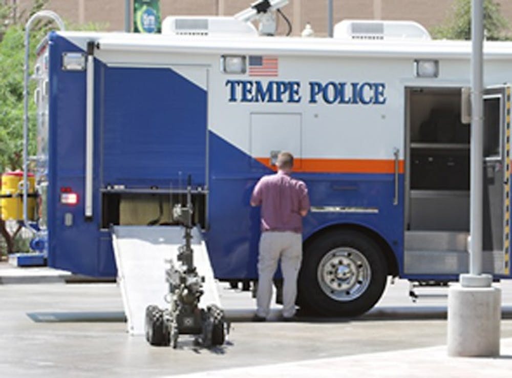 OBOT: Tempe Police used a robot to investigate a suspicious package in front of the police department building Friday. (Daniel Dickson | ASU Student Media) 