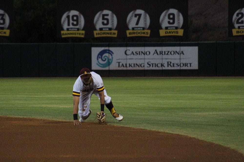 ASU Freshman Infielder Carter Aldrete (21) fields a ground ball&nbsp;in the second inning of a baseball game against the Arizona Wildcats. The grab recorded the second out of the inning&nbsp;and retired Arizona Center Fielder Jared Oliva at Phoenix Municipal Stadium in Phoenix, Arizona on Saturday,&nbsp;May 20, 2017. ASU lost 5-9