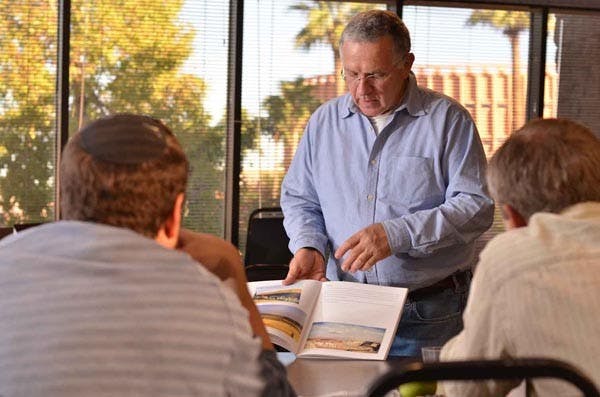 PAINTING FOR HOPE: Avner Moriah, artist in residence at the Hillel Jewish Student Center in Tempe, is an Israeli painter that has delivered messages of hope through his paintings of scenes from the book of Genesis. (Photo by Aaron Lavinsky)