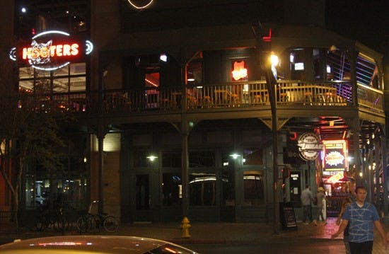 THE FALL: Tempe Hooter's sign shines from the second story balcony where Canadian citizen Tabitha Farmer plummeted 20 feet on April 7th. (Photo by Serwaa Adu-Tutu)