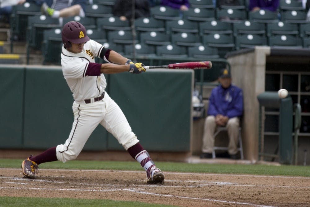 ASU freshman first baseman Lyle Lin (27) hits a double in the first inning of a  baseball game versus the Northwestern Wildcats in Phoenix Municipal Stadium in Phoenix, Arizona on Saturday, Feb. 18, 2017. (Josh Orcutt/State Press)