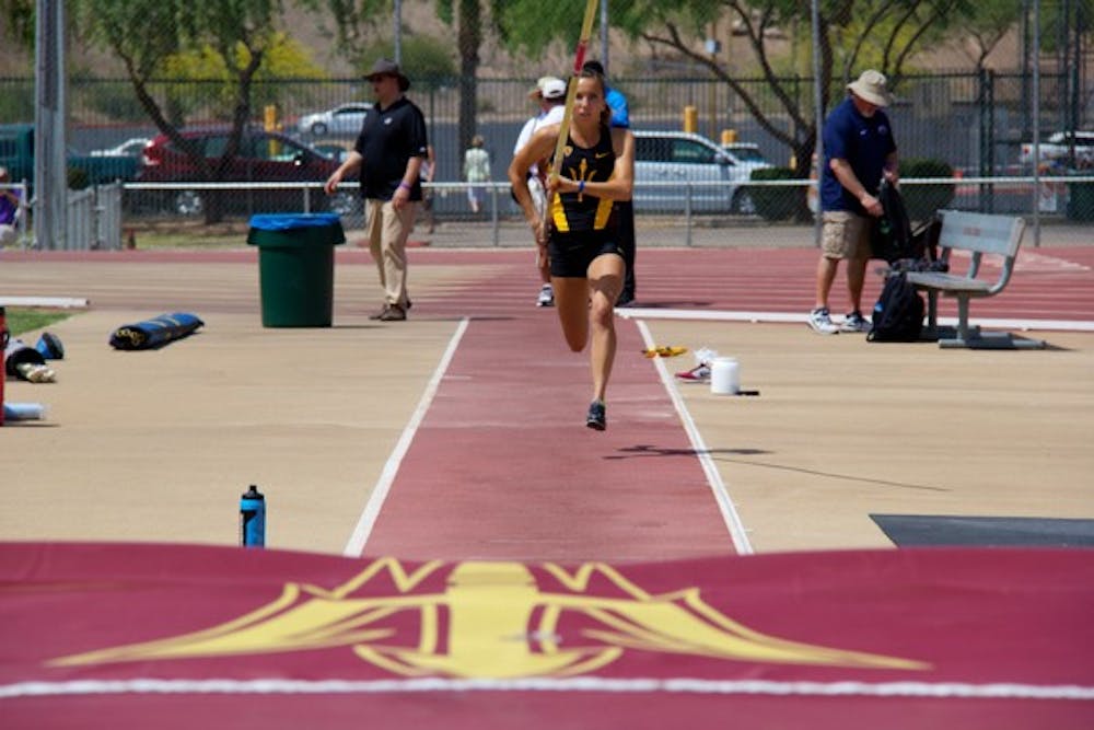 Then-Sophomore pole-vaulter Andrea Kremmerrer gets a running start before jumping over the bar during the Sun Angel Track Classic at Sun Angel Stadium on Saturday,
April 12. (Photo by Becca Smouse)