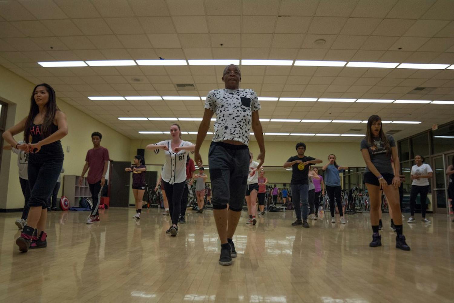 Choreographer Darrell Wilmore teaches the Hip Hop Coalition a new dance during practice on Tuesday, April 19, 2016, in the Tempe SDFC.