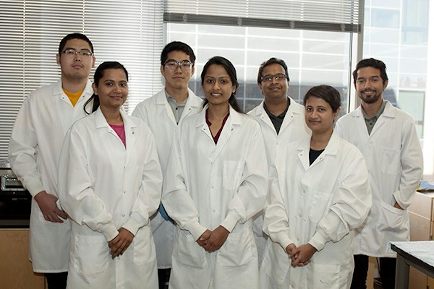 (Back row from left to right) Graduate biomedical students Haiqing Wang and Tyson Tsutsumi, Professor Vikram Kodibagkar, and graduate biomedical student Carlos Renturia, (front row from left to right) biomedical doctoral students Shubhangi Agasuial, Vimala N. Bharadway, and Rohini Vidya Shankar, are part of a research team supported by the National Science Foundation. Exploring new imaging techniques, they aim to discern the correlation between aggressive tumors and oxygen deficiency in cells. (Photo by Mario Mendez)