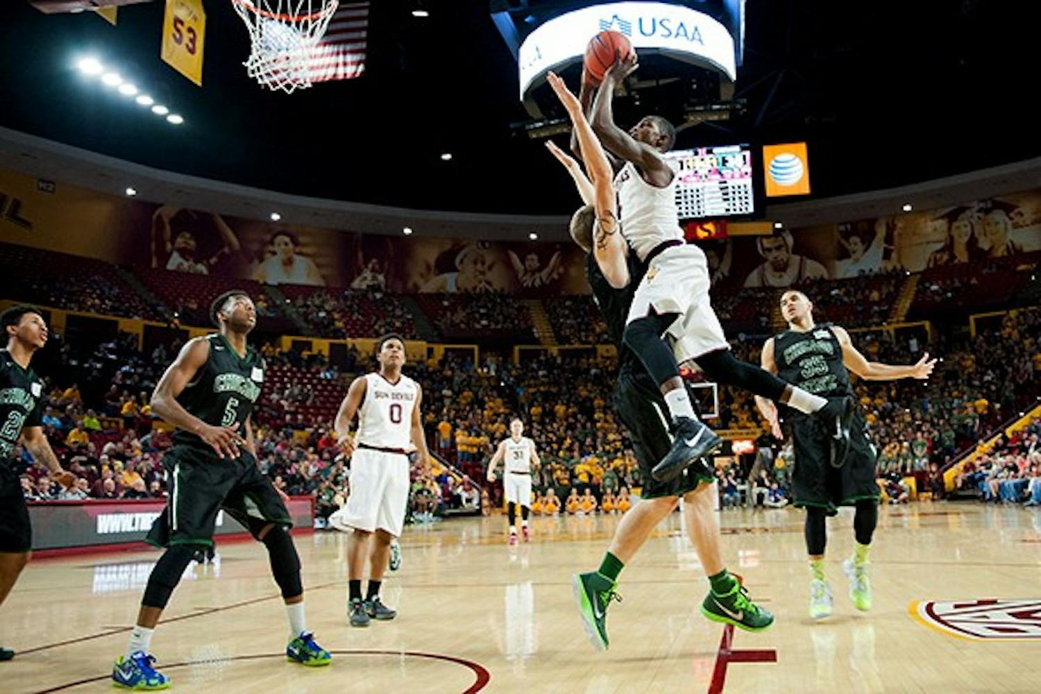 Junior guard Gerry Blakes goes up for a layup in a game against Chicago State, Friday. Nov. 14, 2014 at Wells Fargo Arena in Tempe. The Sun Devils defeated the Cougars 81-67. (Photo by Ben Moffat)