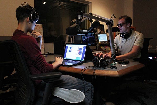 Journalism freshmen Tyler Beemer (left) and Phoenix Carlton play electronic music during their Blaze radio show on Feb. 15. (Photo by Alexis Macklin) 