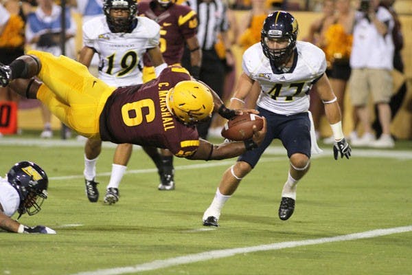 Senior running back Cameron Marshall dives into the end zone for a touchdown during ASU’s 63-6 win over NAU on Thursday. Marshall led the Sun Devils with two rushing touchdowns in the first quarter. (Photo by Sam Rosenbaum)
