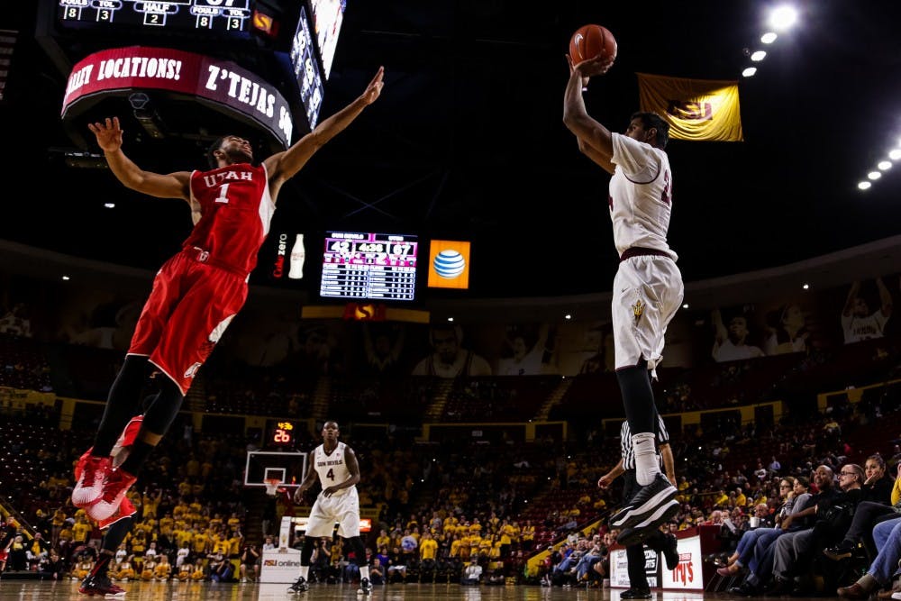 12.	Arizona State junior forward Sai Tummala shoots a three pointer vs Utah freshman guard Isaiah Wright at the ASU vs Utah men’s basketball game at the Wells Fargo Arena on Jan. 15, 2015. Tummala would make the three but the Sun Devils would fall to the Utes 59-76.