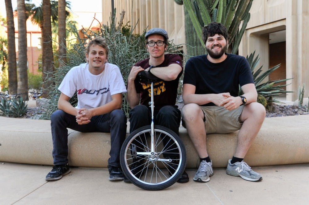 ASUnicycle members Stephen Seidel, left, Lyle Hailey, middle, John Larsen, right, pose for a portrait on the Tempe campus on Tuesday, Feb. 23, 2016. 