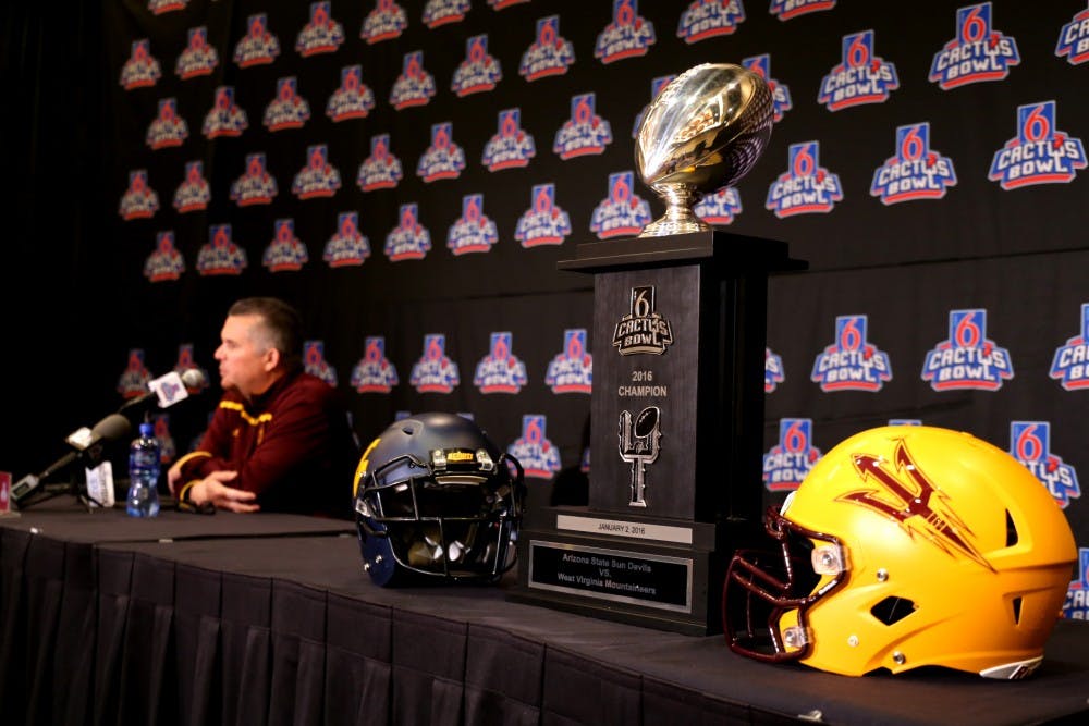 The Cactus Bowl trophy is pictured next to Arizona State head football coach Todd Graham speaking at Arizona State Media Day held at the Camelback Inn on Thursday, Dec. 31, 2015, in Scottsdale, Arizona.