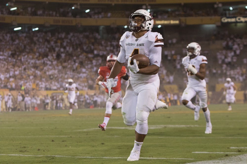 Sophomore running back Demario Richard carries a pass 93 yards for a touchdown against New Mexico on Friday, Sept. 18, 2015, at Sun Devil Stadium in Tempe.