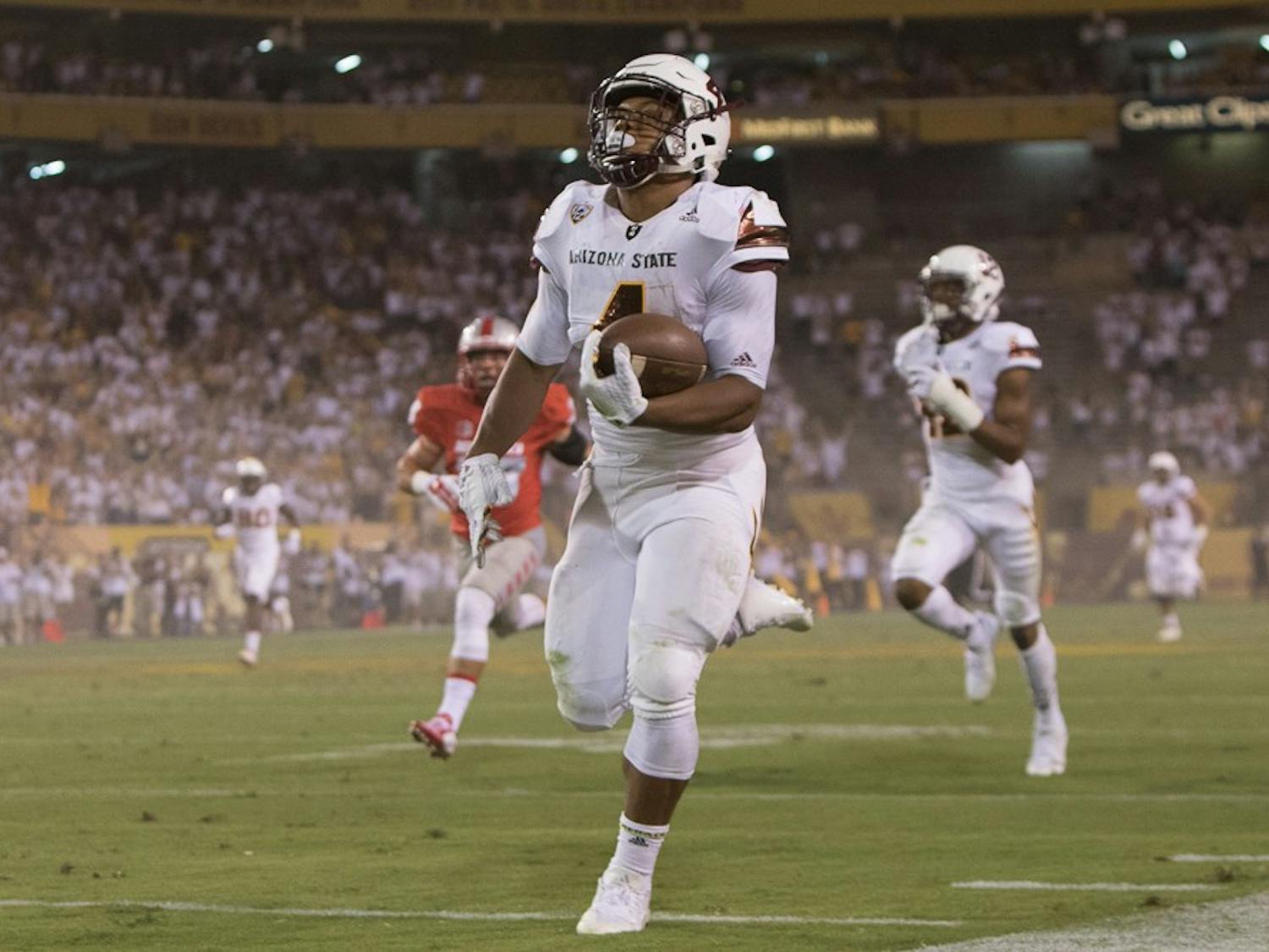 Sophomore running back Demario Richard carries a pass 93 yards for a touchdown against New Mexico on Friday, Sept. 18, 2015, at Sun Devil Stadium in Tempe.
