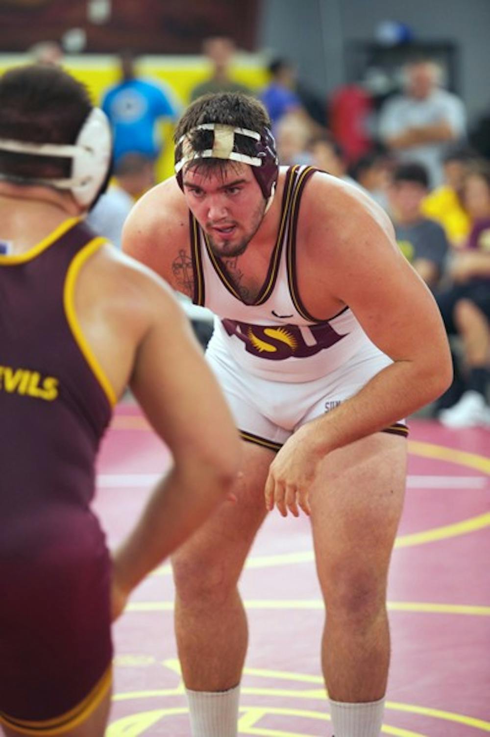 NOT JUST A SCRIMMAGE: ASU redshirt junior Levi Cooper stares down a teammate during a wrestle-off last year. This year’s edition showcased a healthy Cooper and several up-and-coming freshmen. (Photo by Michael Arellano)