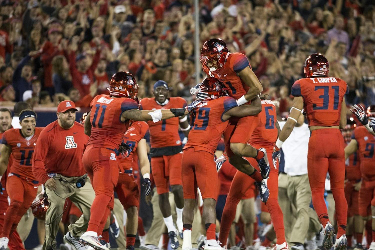 The UA football reacts after an interception in the first quarter of the annual Territorial Cup football game against UA in Tucson's Arizona Stadium on Friday, Nov. 25, 2016.