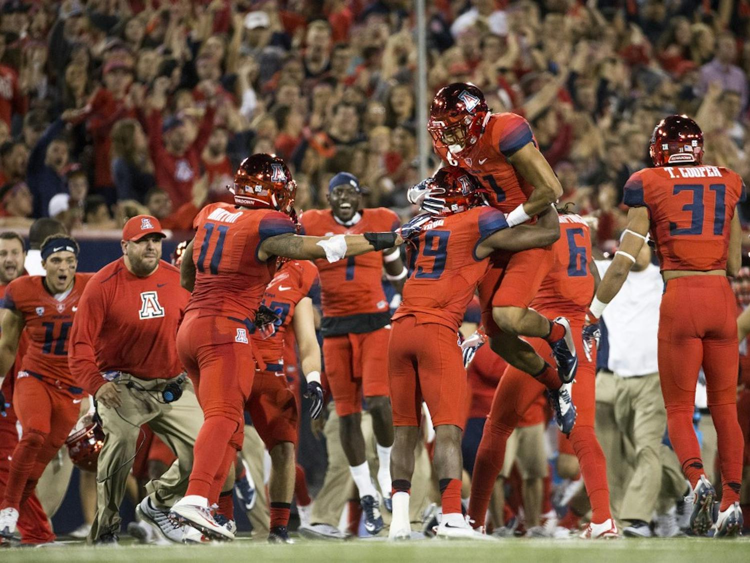 The UA football reacts after an interception in the first quarter of the annual Territorial Cup football game against UA in Tucson's Arizona Stadium on Friday, Nov. 25, 2016.