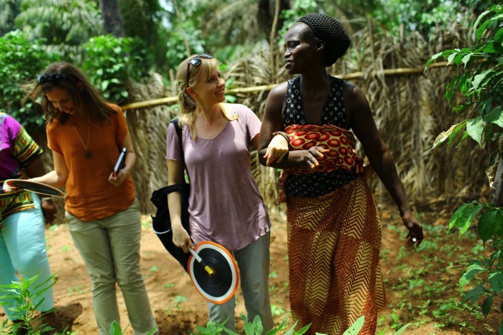 Felicienne shows Anissa her home, garden and chickens which&nbsp;has improved child nutrition in her community. Photo courtesy of Anissa Rasheta.