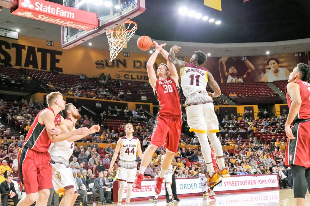 Junior Forward Savon Goodman makes the jump and defensive block against  Stanford on Thursday, March 3, 2016 at the Wells Fargo Arena in Tempe,  AZ. (J. Bauer-Leffler/The State Press)