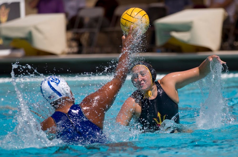 ASU sophomore Rosie Huck (5) tries to block a shot from a San Jose State player during a water polo game versus the San Jose State University Spartans at Mona Plummer Aquatic Center in Tempe, Arizona on Saturday, April 15, 2017. ASU won 11-3.