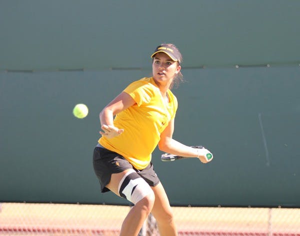 Freshman Desirae Krawczyk turns her racket to prepare for a flop shot on Sept. 9, 2012. The tennis team plays SJSU Wednesday Feb. 13 after not competing for 17 days. (Photo by Kyle Newman)