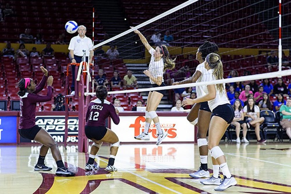 Junior setter Bianca Arellano hits the ball at a home game against North Carolina Central University on Saturday, Sept. 20, 2014 at Wells Fargo Arena in Tempe. The Sun Devils swept the Eagles 3-0. (Photo by Ben Moffat)