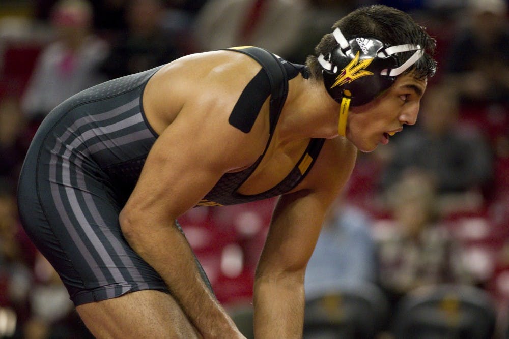 ASU's Zahid Valencia looks towards his opponent during the wrestling meet versus North Carolina in Tempe, Arizona on Friday, Jan. 20, 2017. ASU won the meet 31-9, and Zahid Valencia won 2-1.