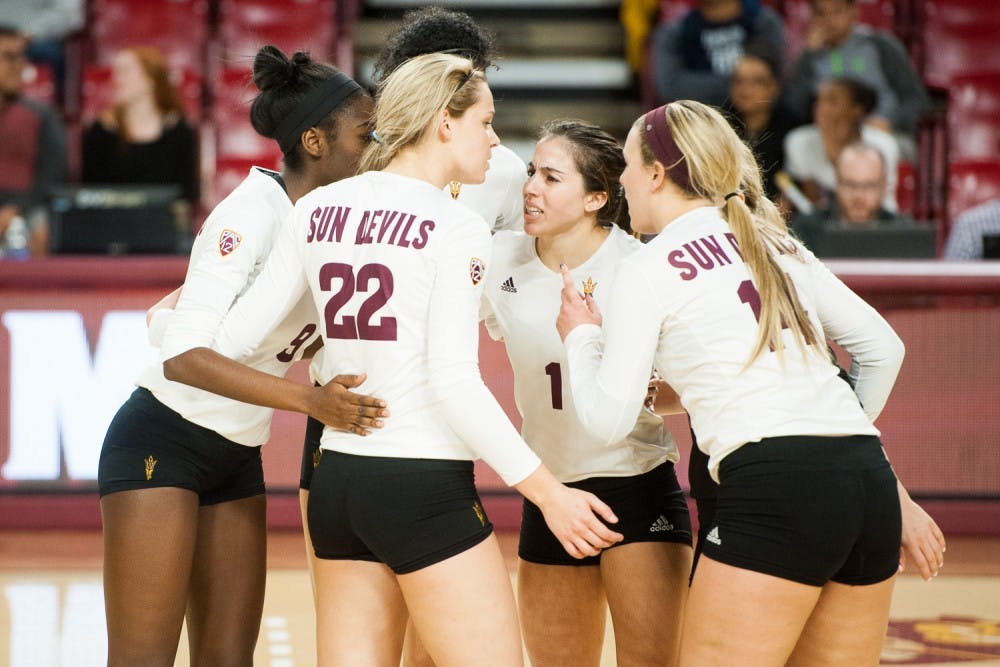 ASU's volleyball team regroups after a point against Washington on Friday, Nov. 6, 2015, at Sun Devil Stadium in Tempe. The Huskies swept the Sun Devils 3-0.