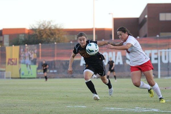 Senior midfielder Taylor McCarter (28) battles with Utah freshman midfielder Kaycee Buckley for the ball during the Sun Devils’ 4-1 win over the Utes on Oct. 25. (Photo by Kyle Newman)
