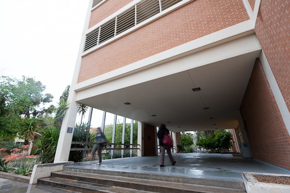 Students enter and exit the Durham Language and Literature Building on the Tempe campus on Wednesday, March 18, 2015.