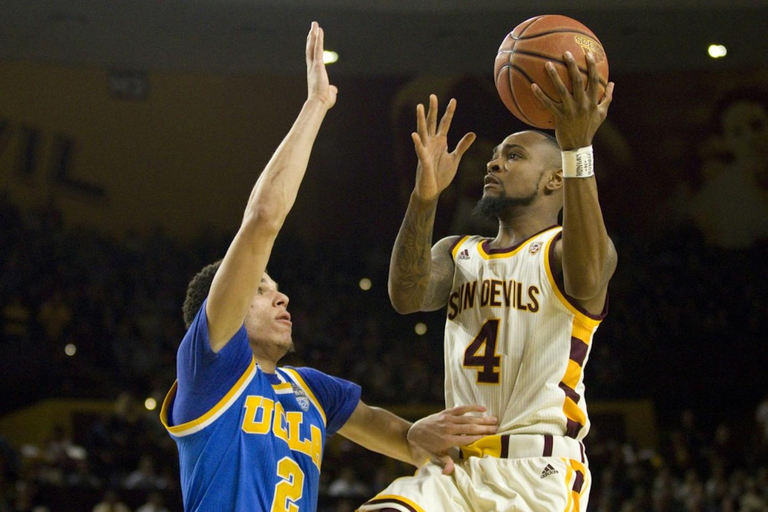 ASU senior guard Torian Graham (4) goes up for a layup with UCLA freshman guard Lonzo Ball (2) guarding during a men's basketball game versus the UCLA Bruins in Wells Fargo Arena in Tempe, Arizona on Thursday, Feb. 23, 2017. ASU lost the game 87-75. (Josh Orcutt/State Press) 